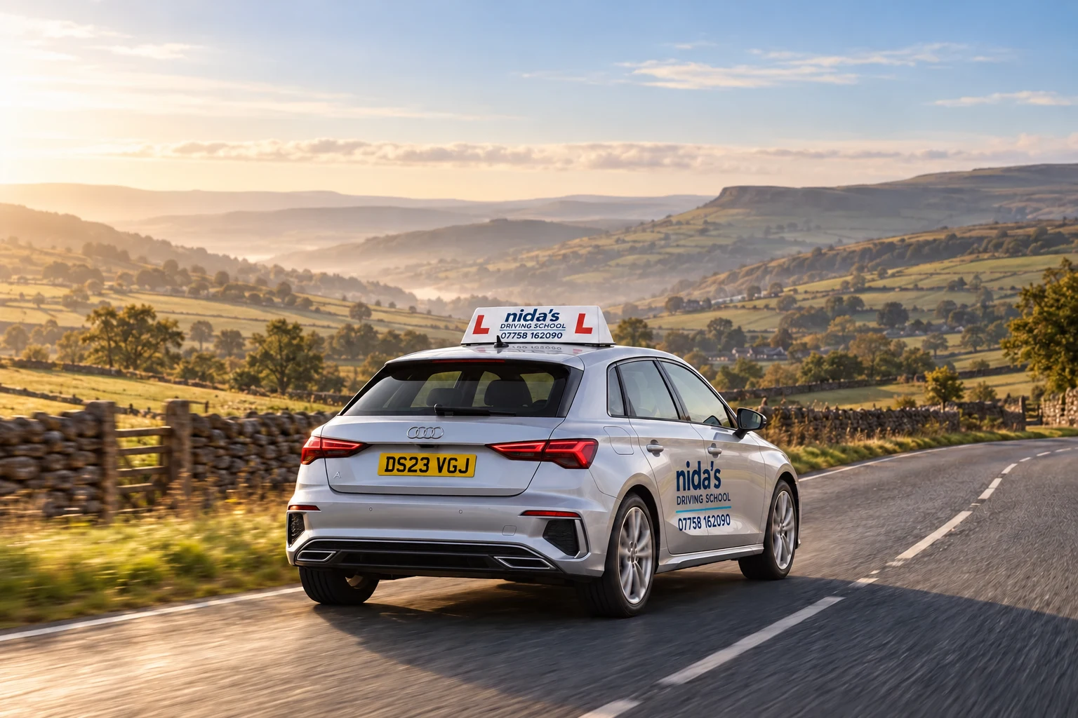 Nida’s-branded silver Audi A3 learner car on a British country road